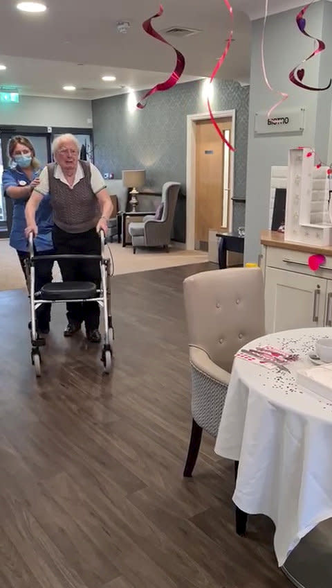 This is the moving moment a devoted wife surprised her dementia-stricken husband by moving into his care home after a month apart - because she 'can't live without him'. Pensioner Kenneth Meredith, 96, walked through the door with his zimmer-frame and broke down in tears when he saw wife Betty Meredith, 91, sitting down in front of him. Seconds later he rushes over to his wife of 71-years, who is seen sitting at a table for a make-shift date night, decorated with heart shaped balloons and roses. With The Platters' 1954 hit 'Only You', playing in the background, the couple share a long hug, after spending five weeks apart. The pair were heartbroken after Kenneth moved into Bourn View Care Home, Birmingham, five weeks ago due to his worsening battle with Alzheimer's. Due to strict rules, he couldn't see wife Betty, who he has been with for 76 years. And with no sign the pandemic was lifting, lonely Betty asked if she could be moved into the care home because she could no longer be apart from her husband. Unbeknown to Kenneth, Betty had moved into the floor below as she waited for her Covid-19 test results - but would continue to phone him for their daily chats. Once her results came back negative, Betty and staff helped arrange the surprise for Kenneth on November 10.