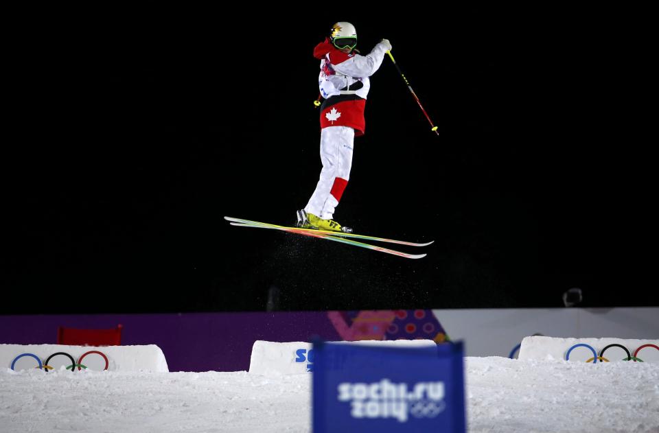 Canada's Chloe Dufour-Lapointe performs a jump during the women's freestyle skiing moguls final competition at the Sochi 2014 Winter Olympics in Rosa Khutor