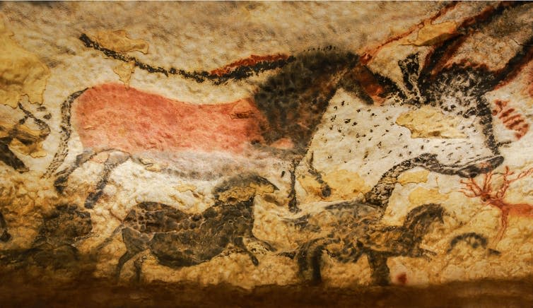 What appear to be bison painted on a cave wall