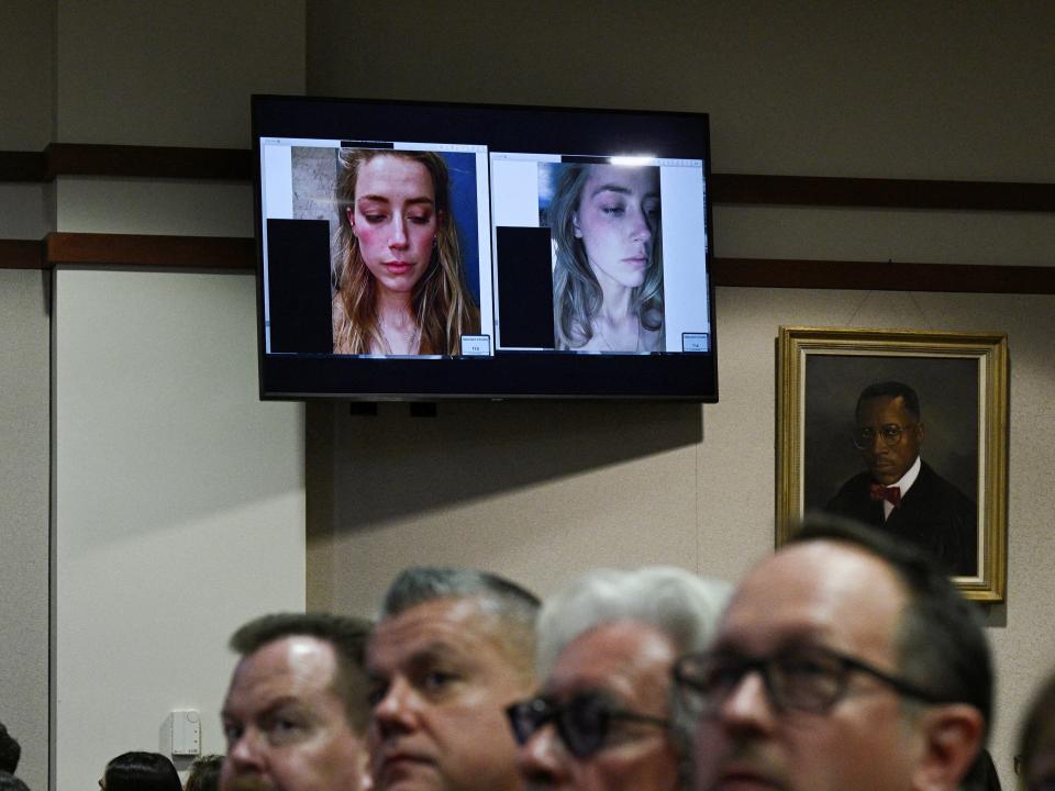 Spectators in the courtroom listen as evidence showing pictures of actor Amber Heard appear on a screen during a defamation trial against her by her ex-husband, actor Johnny Depp, in the courtroom at the Fairfax County Circuit Courthouse in Fairfax, Virginia, U.S. May 17, 2022.