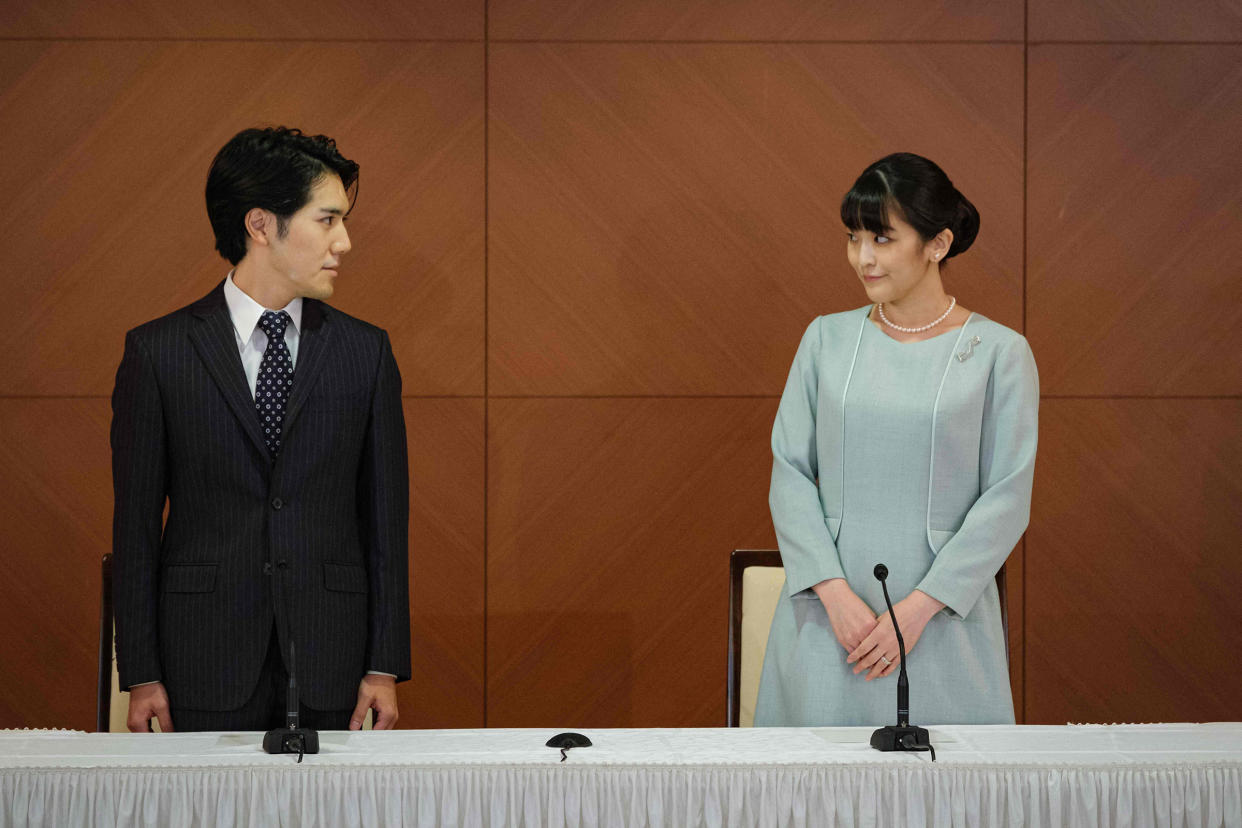 Japan's former Princess Mako (right), and her husband Kei Komuro speak at a press conference to announce they have married, at the Grand Arc Hotel in Tokyo on Oct. 26, 2021.