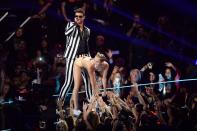 <p>Miley Cyrus shed her Hannah Montana image for good when she backed it up on Robin Thicke during their August 2013 performance of “We Can’t Stop” and “Blurred Lines” at the MTV VMAs, wearing a nude bikini and a foam finger.</p>