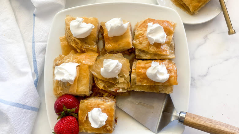 Flaky baklava on white plate