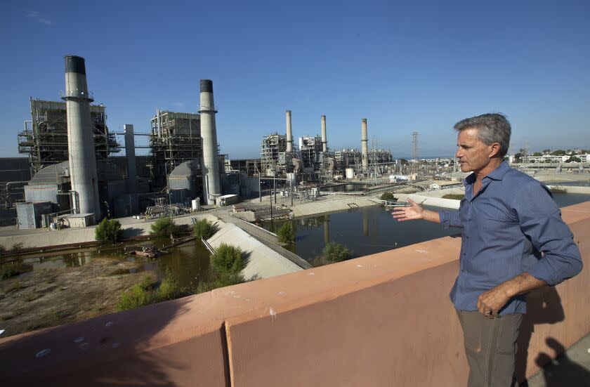 REDONDO BEACH, CA-NOVEMBER 22, 2019: Redondo Beach Mayor Bill Brand is photographed next to the AES Power Plant in Redondo Beach that is currently supposed to close in 2020 due to environmental regulations. California's State Water Resources Control Board is considering a request from the Public Utilities Commission to allow this power plant to stay open longer. Brand is opposed to the extension. (Mel Melcon/Los Angeles Times)