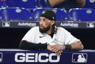 Miami Marlins' Billy Hamilton looks on during the eighth inning of a baseball game against the Pittsburgh Pirates, Thursday, July 14, 2022, in Miami. Hamilton was injured when he slid into home plate to score during the fifth inning. (AP Photo/Wilfredo Lee)
