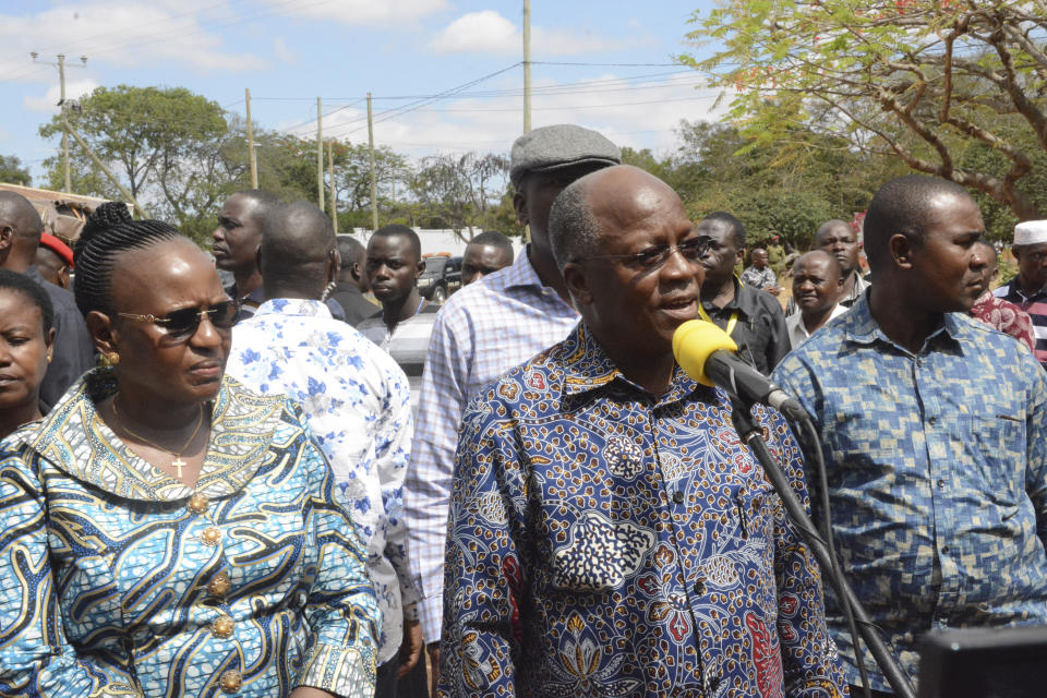 The ruling party CCM Presidential candidate Dr John Magufuli, second left, with his wife Janeth Magufuli, left, addresses Tanzanians after casting their vote at Chamwino in Dodoma Wednesday. Oct.28, 2020. The populist Magufuli, who made his name in part by targeting corruption, now seeks a second five-year term in one of Africa's most populous and fastest-growing economies. (AP Photo)