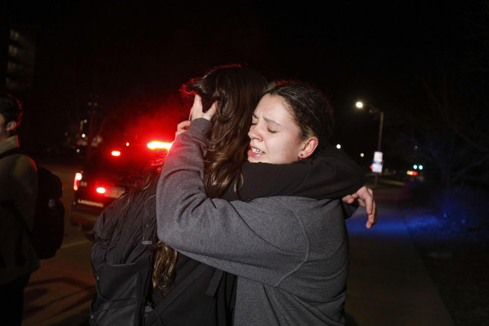 Michigan State University students hugging each other.