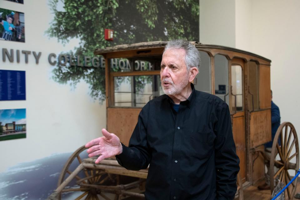 Philantropist Gene Epstein fields questions in front of the old bakery carriage he won the bid for, inside Zlock Performing Arts Center at Bucks County Community College on Thursday, Jan. 12, 2022.