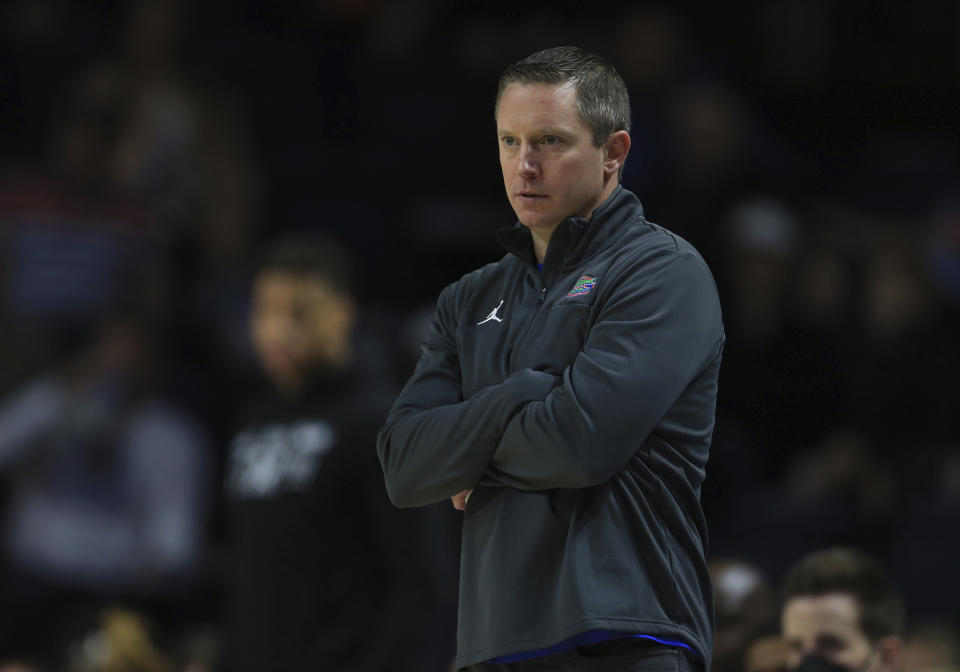 Florida head coach Mike White looks on during the first half of an NCAA college basketball game against Troy, Sunday, Nov. 28, 2021, in Gainesville, Fla. (AP Photo/Matt Stamey)