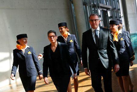 Lufthansa CEO Carsten Spohr (2R) and CFO Simone Menne (2L) walk with personnel to a news conference at Lufthansa headquarters in Frankfurt, Germany, March 17, 2016. REUTERS/Kai Pfaffenbach