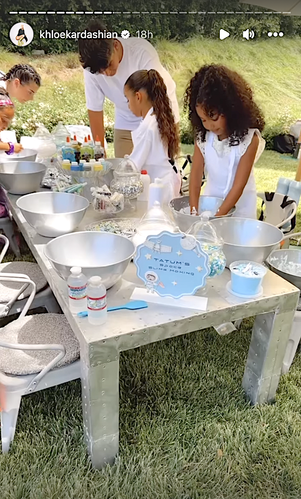 kid station with slime and kendall in the corner looking at the supplies