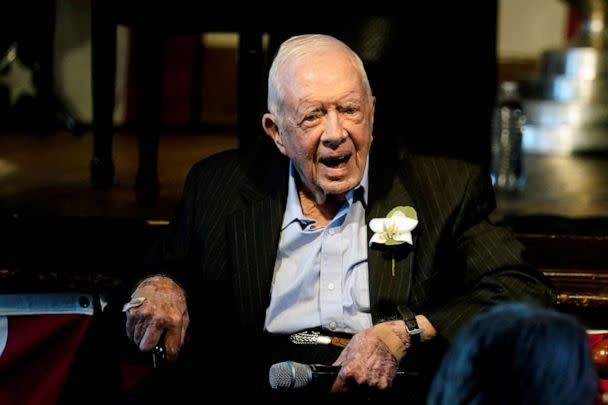 PHOTO: FILE - Former U.S. President Jimmy Carter reacts as his wife Rosalynn Carter speaks during a reception to celebrate their 75th wedding anniversary in Plains, Georgia, July 10, 2021. (Pool/Reuters, FILE)