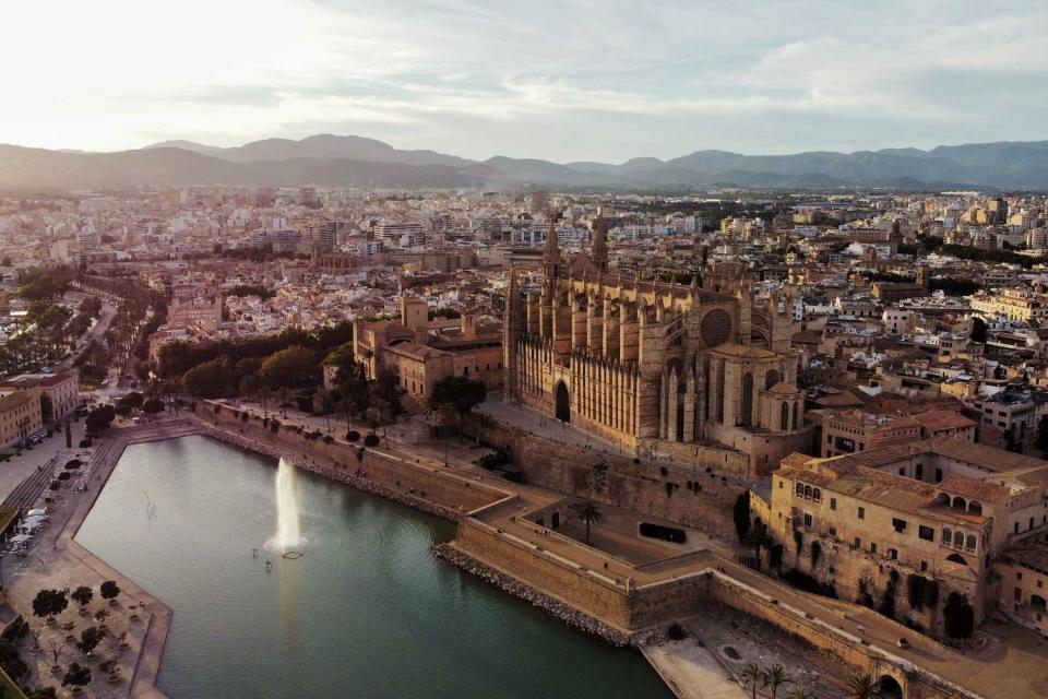 Palma de Mallorca Cityscape with Cathedral and Fountain, Aerial View during Sunset