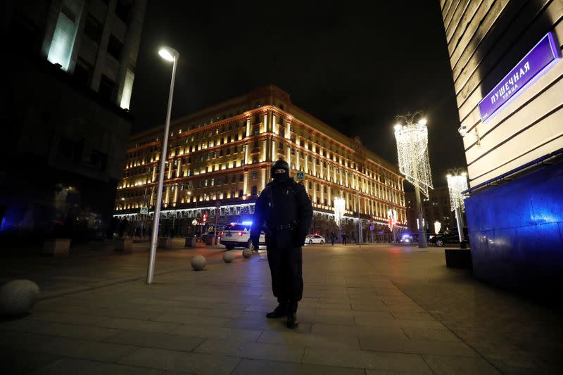 A security officer stands guard on a street near the Federal Security Service (FSB) building after a shooting incident, in Moscow