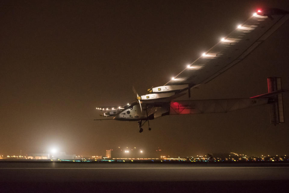 <p>Solar Impulse 2 lands with pilot Andre Boschberg at the helm to finish the first leg of its historic round-the-world journey that began in Abu Dhabi on 9 March 2015. (Jean Revillard via Getty Images)</p>