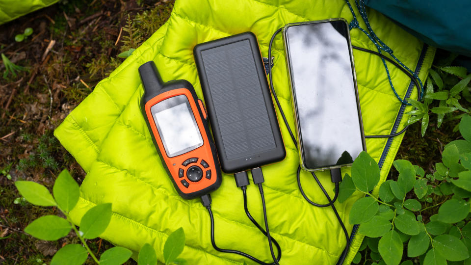 how to charge phones while camping: solar charger with phone and GPS