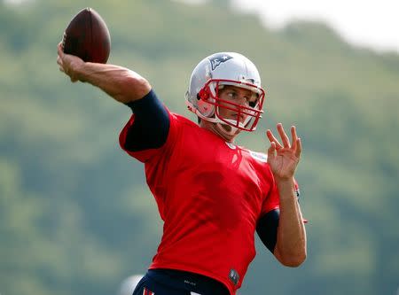 Jul 30, 2015; Foxborough, MA, USA; New England Patriots quarterback Tom Brady (12) throws during training camp at Gillette Stadium. Mandatory Credit: Winslow Townson-USA TODAY Sports