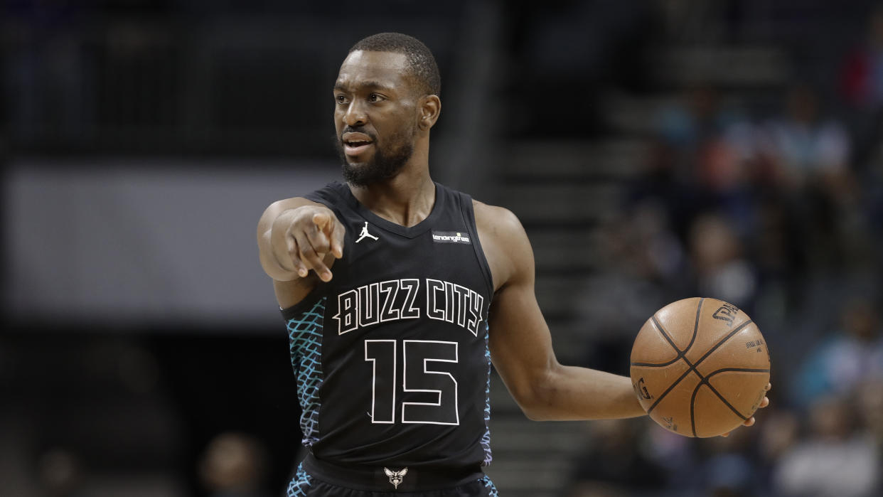 Charlotte Hornets’ Kemba Walker (15) directs his team against the Memphis Grizzlies during the first half of an NBA basketball game in Charlotte, N.C., Thursday, March 22, 2018. (AP Photo/Chuck Burton)