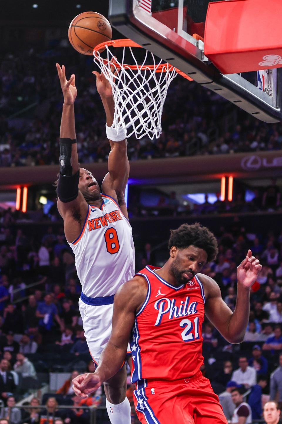 Apr 20, 2024; New York, New York, USA; New York Knicks forward OG Anunoby (8) and Philadelphia 76ers center Joel Embiid (21) during game one of the first round for the 2024 NBA playoffs at Madison Square Garden. Mandatory Credit: Wendell Cruz-USA TODAY Sports