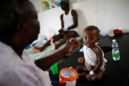 People are treated at a cholera treatment center at a hospital after Hurricane Matthew passed through Jeremie, Haiti, October 11, 2016. REUTERS/Carlos Garcia Rawlins