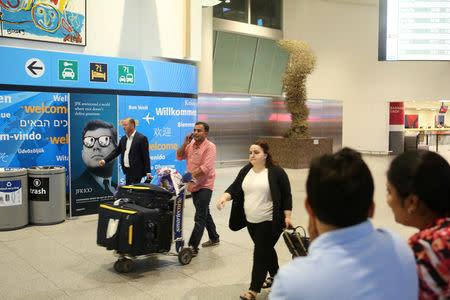 FILE PHOTO: Passengers arrive at Terminal 4 of JFK airport in New York City, U.S., June 29, 2017. REUTERS/Joe Penney/File Photo