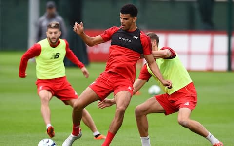 Dominic Solanke and Nathaniel Phillips of Liverpool during a training session at Melwood Training Ground on August 28, 2018 in Liverpool, England.  - Credit: GETTY IMAGES