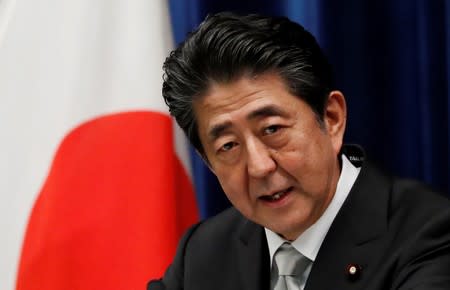 Japan's Prime Minister Shinzo Abe speaks at a news conference after reshuffling his cabinet at his official residence in Tokyo