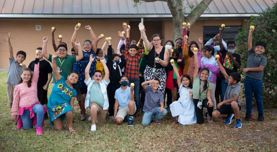 Fourth grade teacher, Amanda Bray, smiles after receiving a Golden Apple award from Champions For Learning on Thursday, April 17, 2022 at Lake Trafford Elementary in Immokalee, Fla. The education foundation made a surprise visit to six schools to recognize teachers and their classroom best practices.