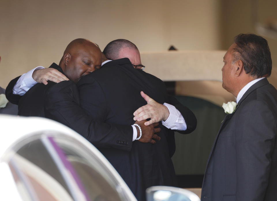 A group of mourners embrace after the funeral service for Jordan Anchondo at San Jose Funeral Homes in El Paso, Texas on Saturday, Aug. 10, 2019. Andre and Jordan Anchondo, were among the several people killed last Saturday, when a gunman opened fire inside a Walmart packed with shoppers. Authorities say Jordan Anchondo was shielding the baby, while her husband shielded them both. (AP Photo/Jorge Salgado)