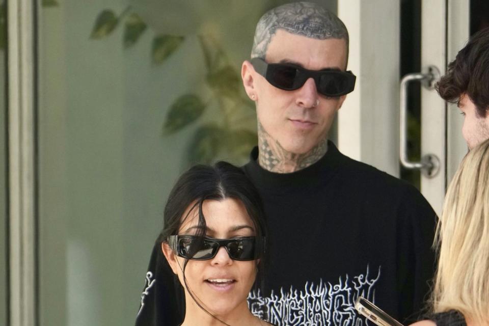 <p>BACKGRID</p> Kourtney Kardashian and Travis Barker spotted grabbing lunch in Brisbane.