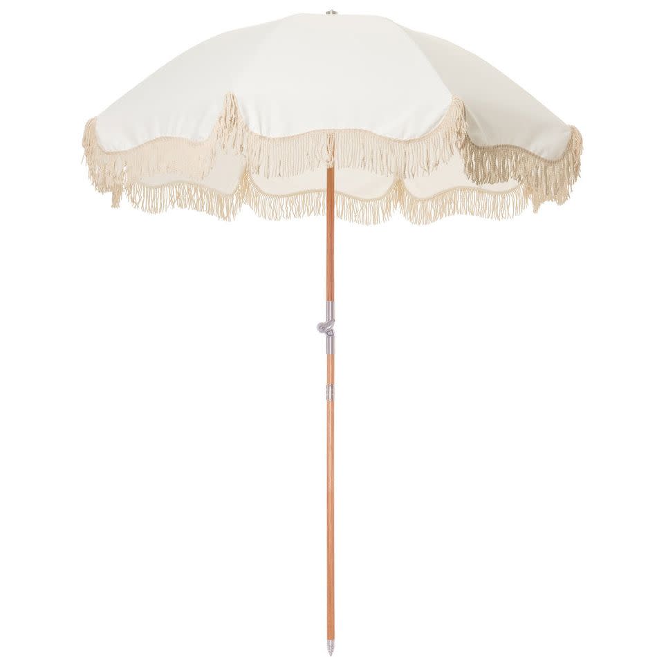 <p><a href="https://businessandpleasureco.com/products/antique-white-beach-umbrella" rel="nofollow noopener" target="_blank" data-ylk="slk:Shop Now;elm:context_link;itc:0;sec:content-canvas" class="link rapid-noclick-resp">Shop Now</a></p><p>The Premium Beach Umbrella</p><p>$299.00</p><p>businessandpleasure.com</p>