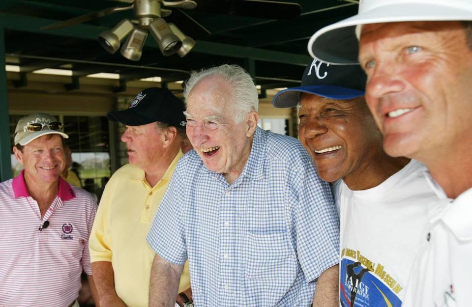 Famed Kansas City Star editor Joe McGuff, center, shared a laugh with the city’s sports legends, from left, Tom Watson, Len Dawson, Buck O’Neil and George Brett during the 2004 Joe McGuff ALS Golf Classic.