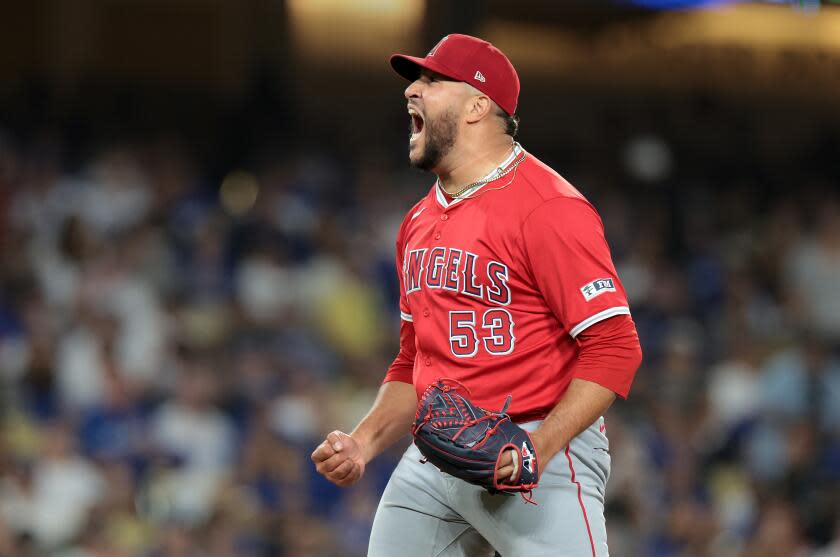 Angels closer Carlos Estevez celebrates after striking out Gavin Lux in the 10th inning.