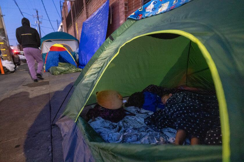 Los Angeles, CA - March 20: Migrant Nubia Reyes son Mateo, 3 sleeps in a Skid Row tent on Wednesday, March 20, 2024 in Los Angeles, CA. (Brian van der Brug / Los Angeles Times)