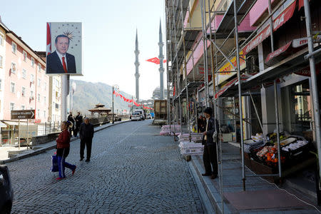 A huge portrait of Turkish President Tayyip Erdogan is seen on a main street of his ancestral hometown Guneysu, a small town in province of Rize on the Black Sea coast, Turkey, April 4, 2017. Picture taken April 4, 2017. REUTERS/Umit Bektas