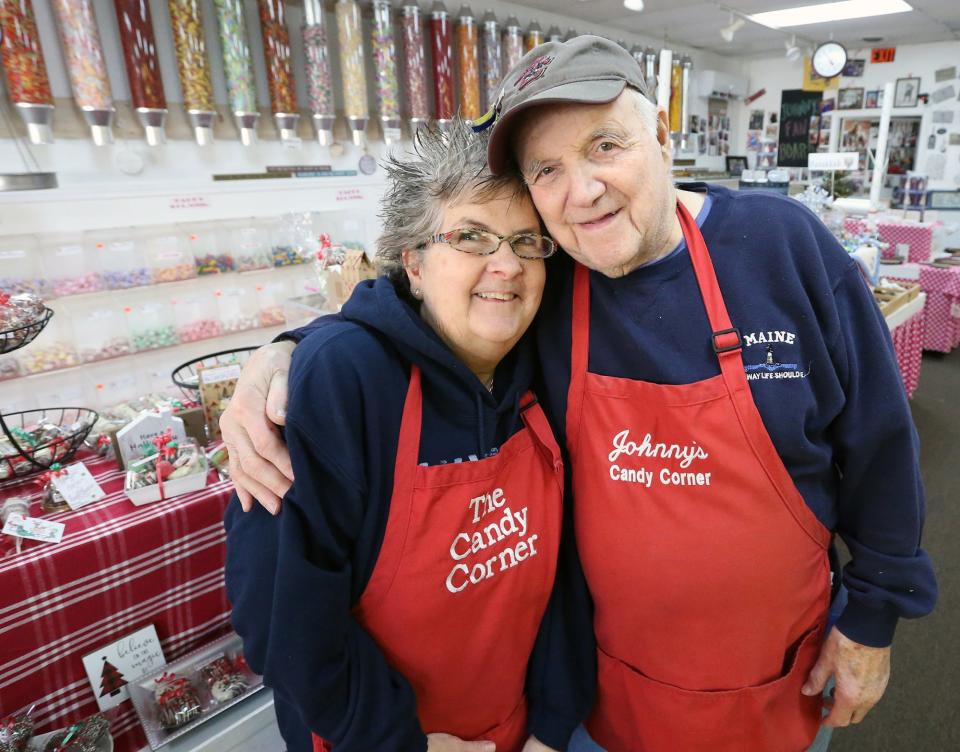 Johnny Biagioni and his daughter Janie pose in front of Johnny’s Candy Corner, their family-owned candy store for 40 years.