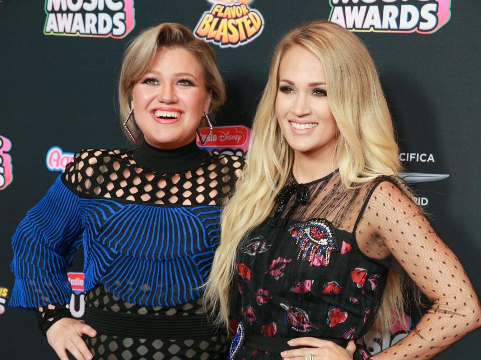 Kelly Clarkson and Carrie Underwood attend the 2018 Radio Disney Music Awards at Loews Hollywood Hotel in Hollywood, CA on June 22, 2018.