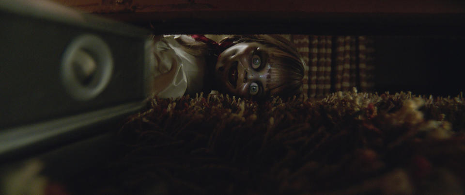 The terrifying "Annabelle" Doll appears under someone's bed