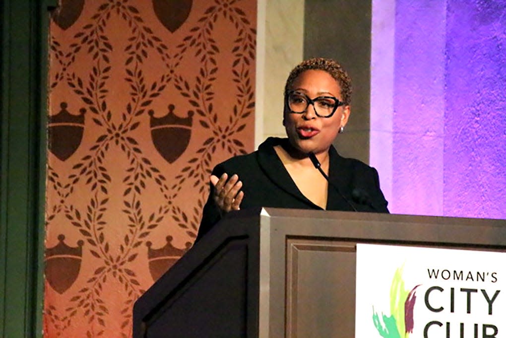 Jenn White, host of National Public Radio's talk show 1A, speaks to attendees of the Woman's City Club of Greater Cincinnati's National Speaker Forum at Memorial Hall on March, 22, 2024.