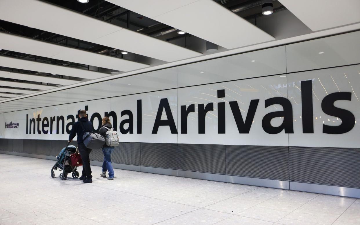 Airline passengers in the arrivals hall at Heathrow Airport in London, UK, on Friday, Dec. 23, 2022 - Hollie Adams/Bloomberg