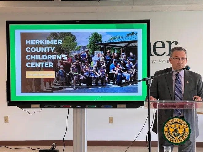 Herkimer County Legislative Chairman Vincent "Jim" Bono presents the idea for an affordable childcare center at Herkimer County's first Community Development Summit in May 2023.