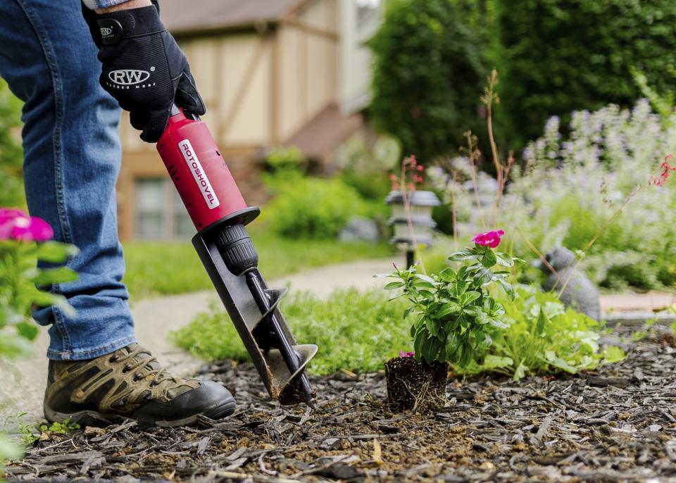 This image provided by Rotoshovel shows a gardener digging a hole with the handheld power digger, one of many available tools designed to make gardening easier. (Rotoshovel.com via AP)