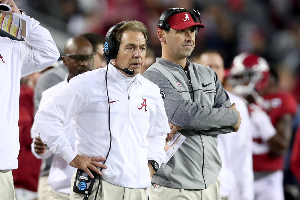 Alabama head coach Nick Saban (L) and offensive coordinator Steve Sarkisian look on during the team's title loss to Clemson. (Getty)