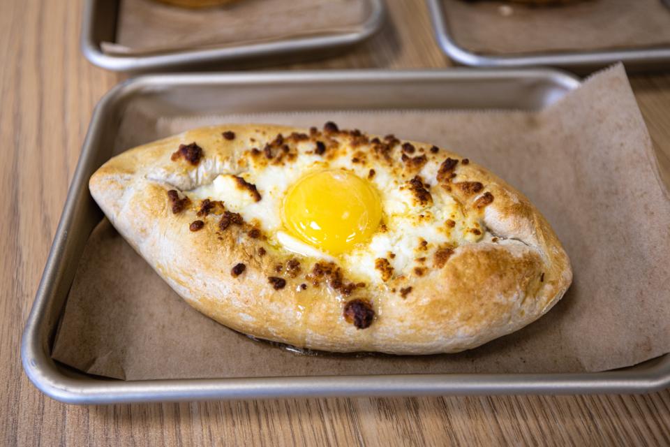 The Eatery’s khachapuri features fluffy bread, perfectly poached egg and melted cheese.
