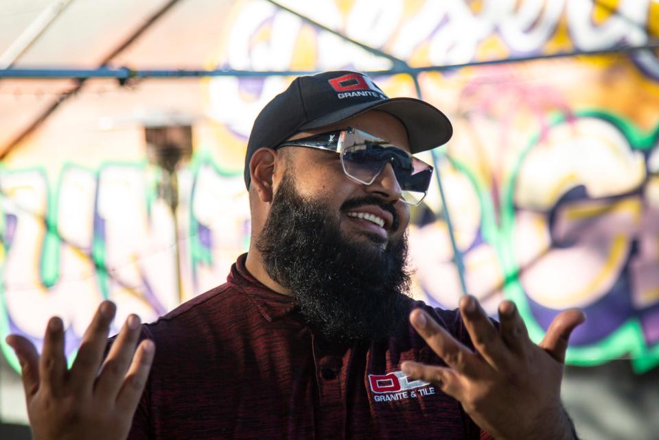 Organizer Angel Chavez talks about what all he needs to do to finish setting up, hours before the start of Desert Underground in his backyard in Coachella, Calif., Friday, Jan. 27, 2023.