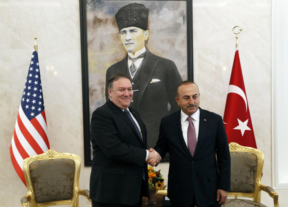 U.S. Secretary of State Mike Pompeo shakes hands with Turkish Foreign Minister Mevlut Cavusoglu before their official talks in Ankara, Turkey, Wednesday Oct. 17, 2018. On Wednesday a pro-government Turkish newspaper published a report made from what they described as an audio recording of Saudi writer and journalist Jamal Khashoggi's alleged torture and slaying at the Saudi Consulate in Istanbul. (Leah Millis/Pool via AP)