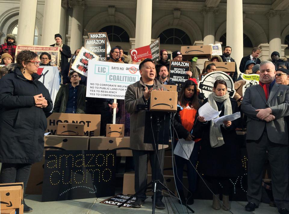 In this Dec. 12, 2018, file photo, New York State Assemblyman Ron Kim, center, speaks at a rally opposing New York's deal with Amazon on the steps of New York's City Hall.