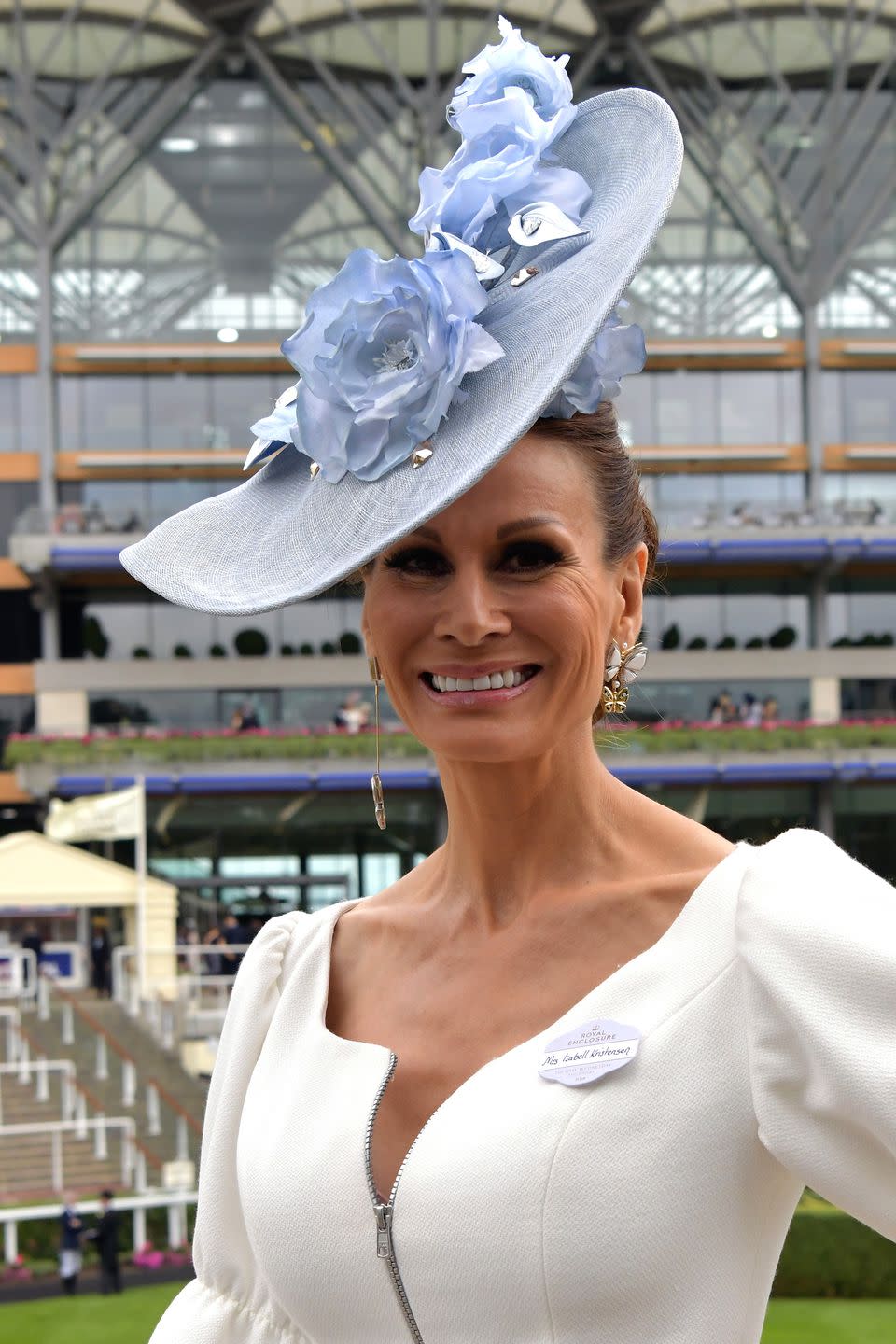 <p>Fashion designer Isabell Kristensen wore a periwinkle flower headpiece. </p>