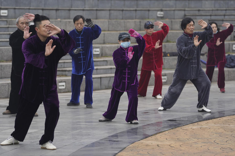 Residents practice tai chi at a park in Wuhan in central China's Hubei Province on Saturday, Jan. 23, 2021. A year after it was locked down to contain the spread of coronavirus, the central Chinese city of Wuhan has largely returned to normal, even as China continues to battle outbreaks elsewhere in the country. (AP Photo/Ng Han Guan)