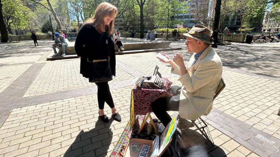 Marshall Kavanaugh reads a poem he wrote for Michelle Chapman's son, who's turning 17. Kavanaugh writes for tips, producing poetry on demand in public places.